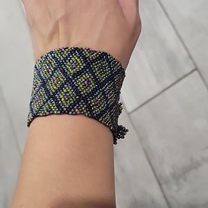 Lilly fashion  beaded bracelet  with 3 knobs to Secure it